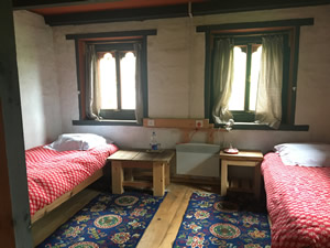 Schlafzimmer im alten Cottage von Ogyen Choling